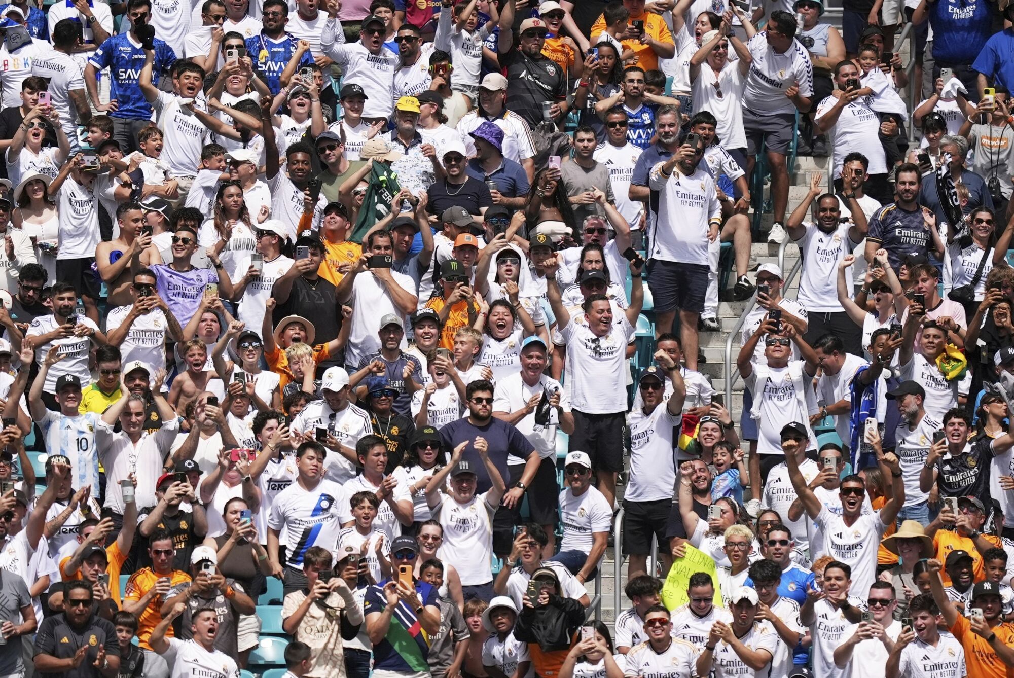 Fans cheer after the opening goal during the Club World Cup group H soccer match between Real Madrid and Al Hilal in Miami Gardens, Fla., Wednesday, June 18, 2025. (AP Photo/Rebecca Blackwell)