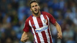 Koke Resurrección celebra un gol contra el Málaga.