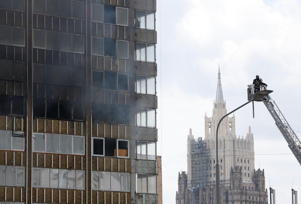 Firefighters work to extinguish fire at a ...