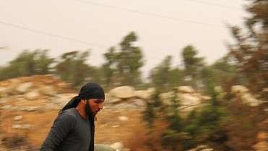Un rebelde, en Alepo. // Reuters