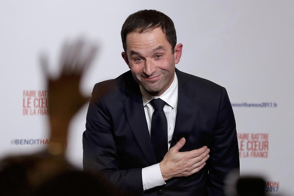 Former French education minister Benoit Hamon reacts after partial results in the second round of the French left’s presidential primary election in Paris, France, January 29, 2017.    REUTERS/Christian Hartmann