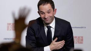 Former French education minister Benoit Hamon reacts after partial results in the second round of the French left’s presidential primary election in Paris, France, January 29, 2017.    REUTERS/Christian Hartmann