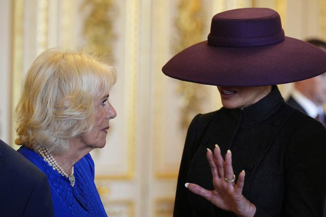 Britains Queen Camilla, left, and first lady Melania Trump talk during their visit to Windsor Castle, in Windsor, England, Wednesday Sept. 17, 2025. (Aaron Chown/Pool Photo via AP). POOL PHOTO