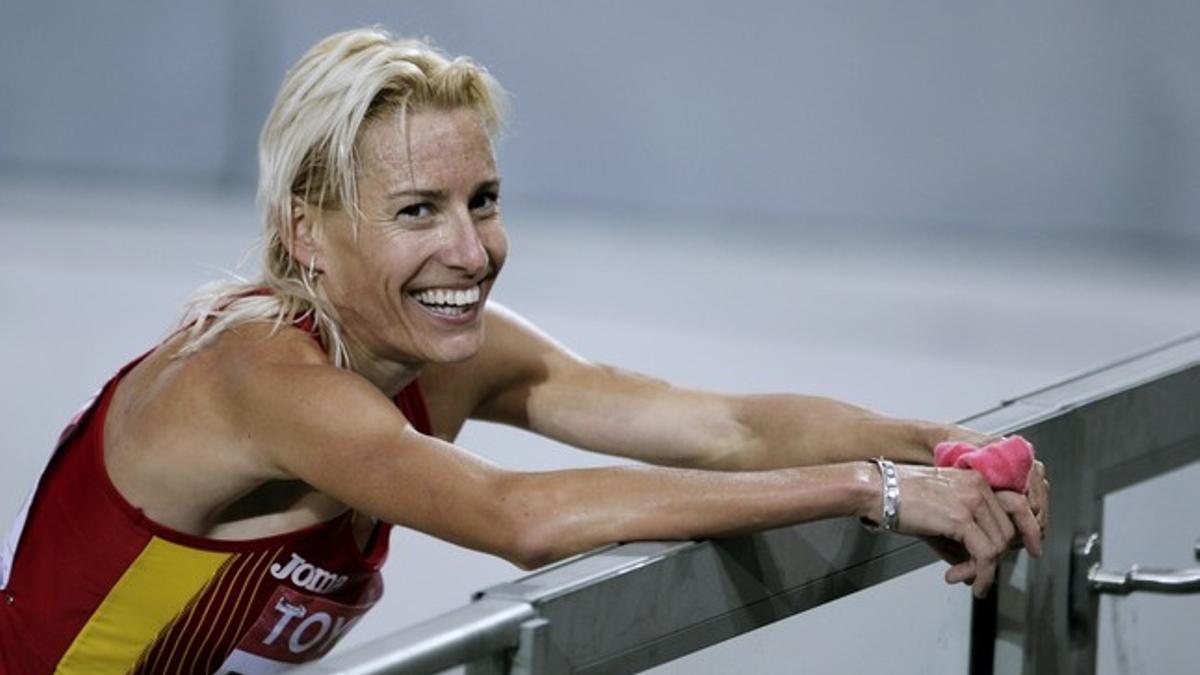 Marta Domínguez celebra la victoria en la final de los 3.000 metros obstáculos de los campeonatos mundiales de atletismo de Berlín 2009.