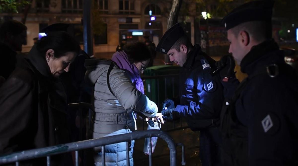 fcasals36260243 police officers search people outside the bataclan concert h161112203700