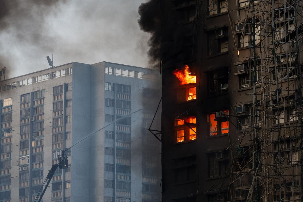 Firefighters work the scene of a fire at Wang Fuk Court, a residential estate in the Tai Po district of Hong Kongs New Territories, on Wednesday, Nov. 26 2025. (AP Photo/Chan Long Hei)