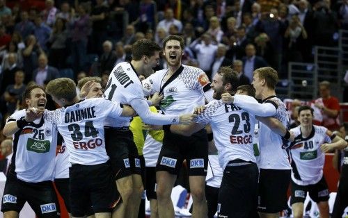 German players celebrate victory against Spain in their Men's European Handball Championship final match in Krakow