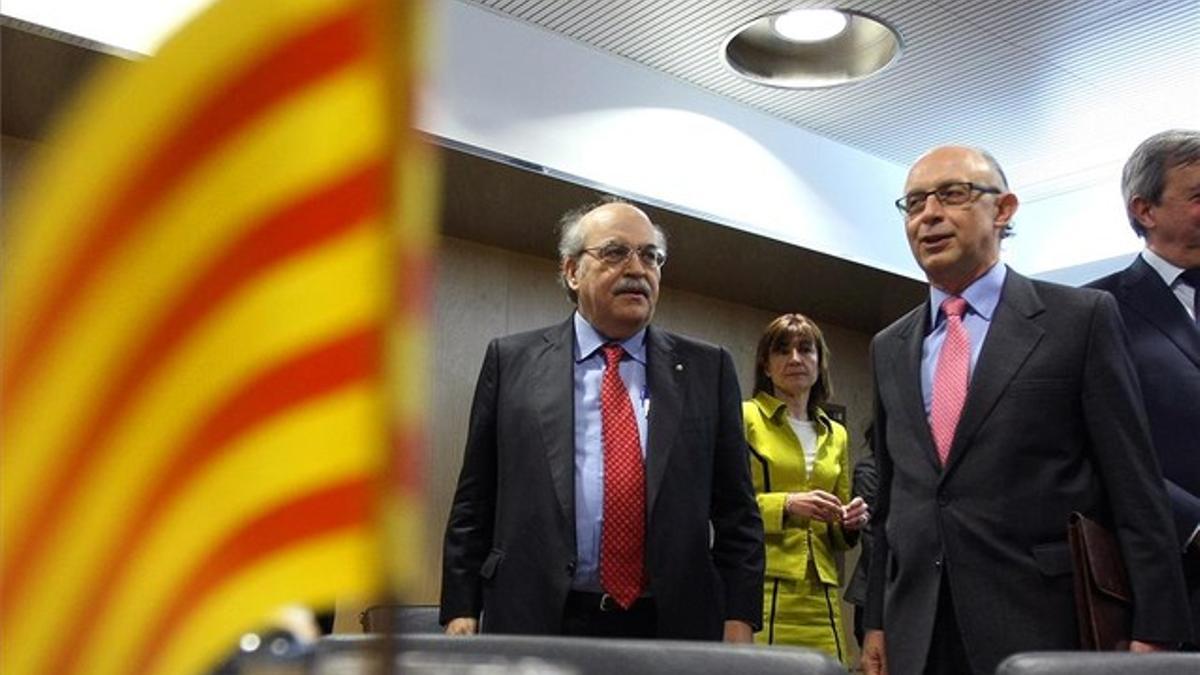 El 'conseller' Andreu Mas-Colell y el ministro Cristobal Montoro, en la reunión del Consejo de Política Fiscal y Financiera celebrada en marzo