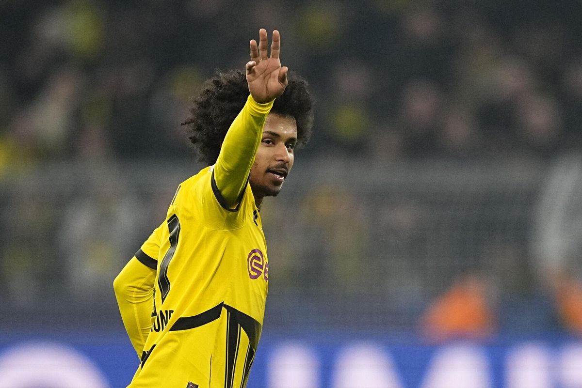 Dortmund's Karim Adeyemi celebrates after scoring the opening goal of his team during the Champions League round of 16 first leg soccer, between Borussia Dortmund and Lille at the Signa-Iduna Park in Dortmund, Germany, Tuesday, March 4, 2025. (AP Photo/Martin Meissner)