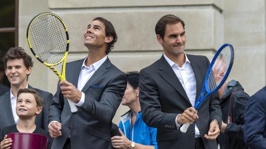 Rafa Nadal y Roger Federer, durante un acto promocional. // EFE