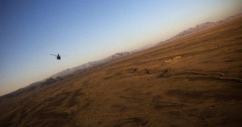 A U.S. Army Blackhawk helicopter flies above Kandahar Province