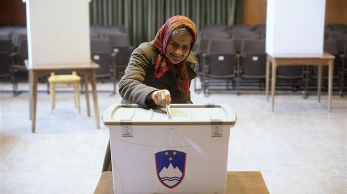 myakovenko32217645 a woman casts a ballot at a polling station during151221105304