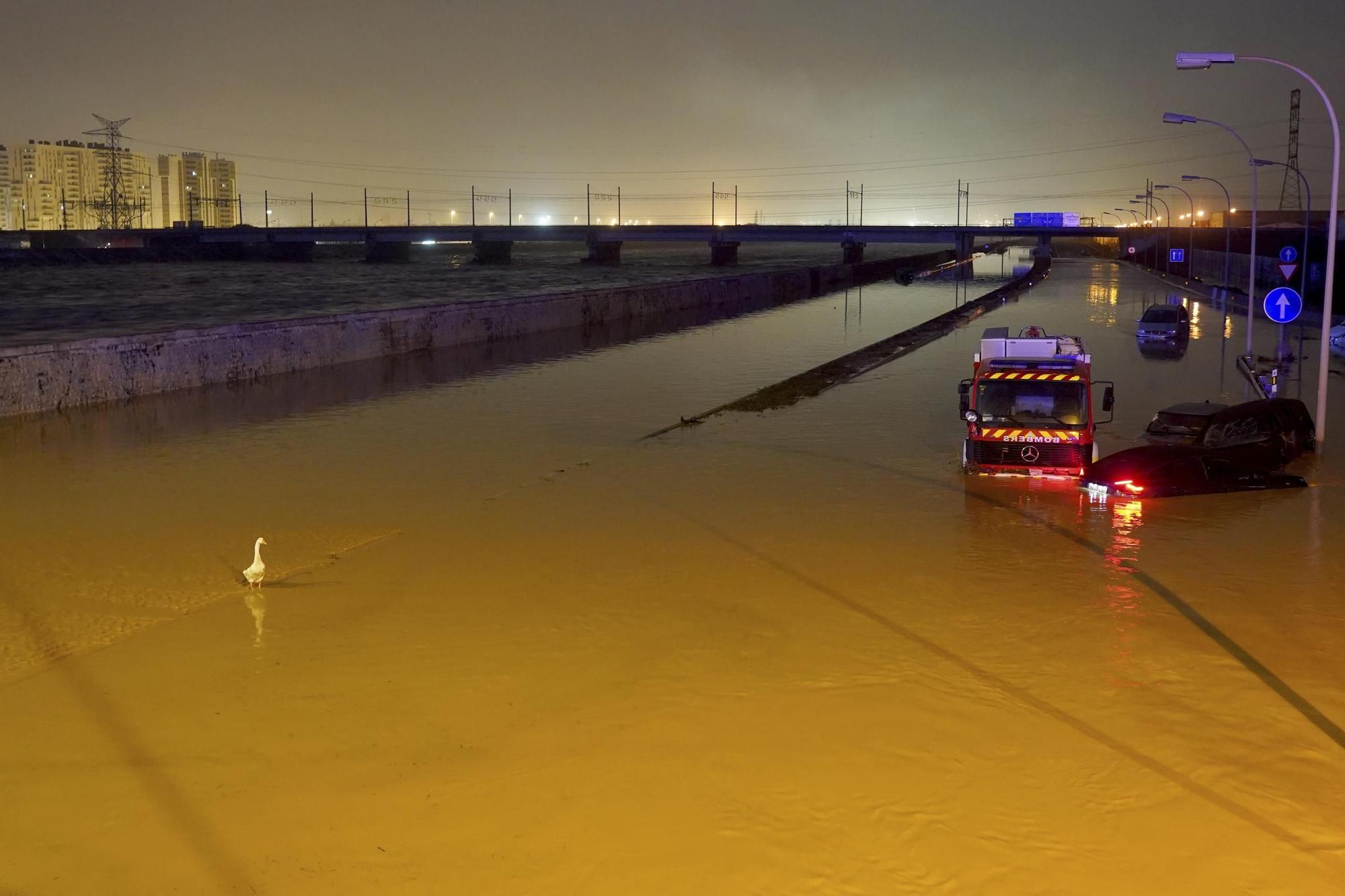 Cars are trapped by flooding in Valencia, Wednesday, Oct. 30, 2024. (AP Photo/Alberto Saiz)
