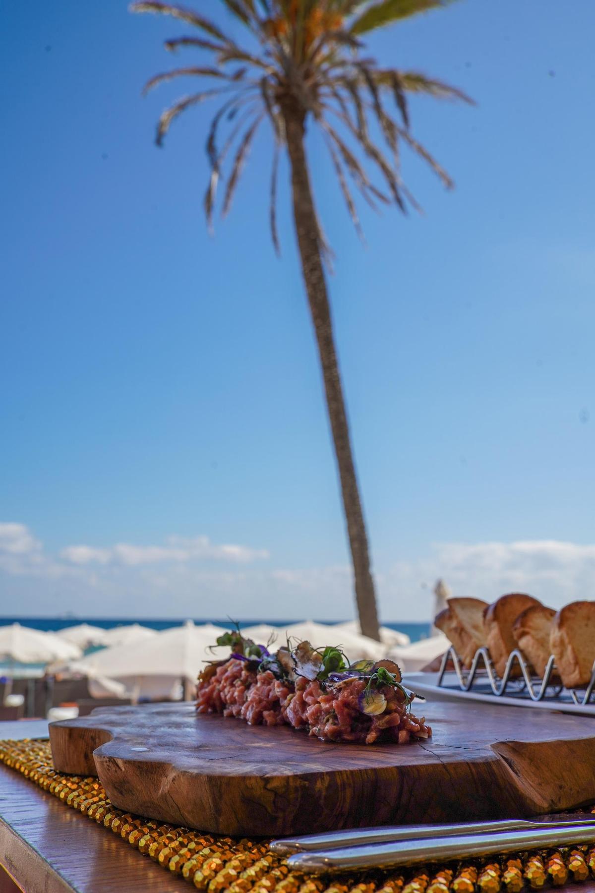 At Nassau Beach Club, you can dine with your feet in the sand.