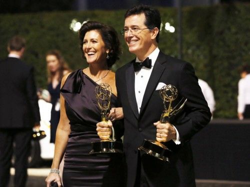 Stephen Colbert from Comedy Central's show "The Colbert Report" poses with his awards for Outstanding Variety Series and Outstanding Writing For A Variety Series with his wife Evelyn McGee