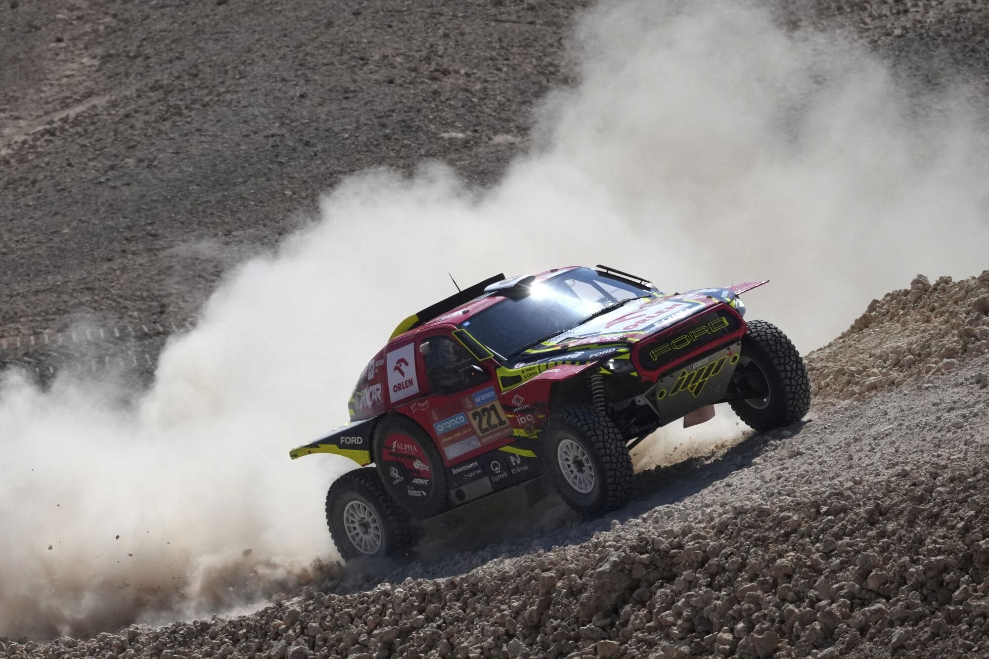 Driver Martin Prokop and co-driver Viktor Chytka compete during the ninth stage of the Dakar Rally between Riyadh and Haradh, Saudi Arabia, Tuesday, Jan. 14, 2025. (AP Photo/Christophe Ena)