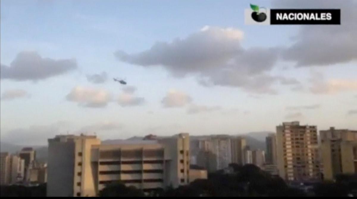 A police helicopter flies over Venezuela’s Supreme Court building in Caracas June 27, 2017, in this still image taken from a video. Mandatory credit Caraota Digital - MUST COURTESY CARAOTA DIGITAL/Handout via REUTERS  ATTENTION EDITORS - THIS IMAGE HAS BEEN SUPPLIED BY A THIRD PARTY. NO RESALES. NO ARCHIVE. MUST COURTESY CARAOTA DIGITAL. VENEZUELA OUT. NO COMMERCIAL OR EDITORIAL SALES IN VENEZUELA     TPX IMAGES OF THE DAY