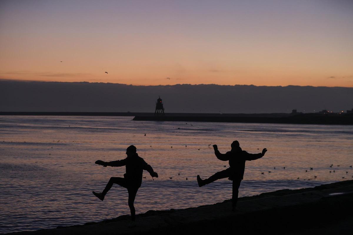 People practise tai chi at dawn in North Shields