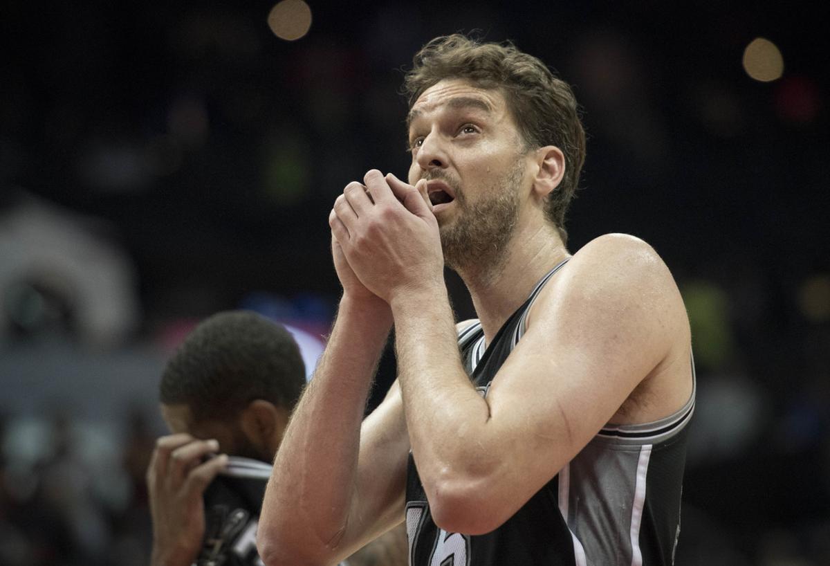 San Antonio Spurs center Pau Gasol, of Spain, comes back down the court after missing a free throw during overtime in the team’s NBA basketball game against the Atlanta Hawks, Sunday, Jan. 1, 2017, in Atlanta. Atlanta won 114-112 in overtime. (AP Photo/John Amis)