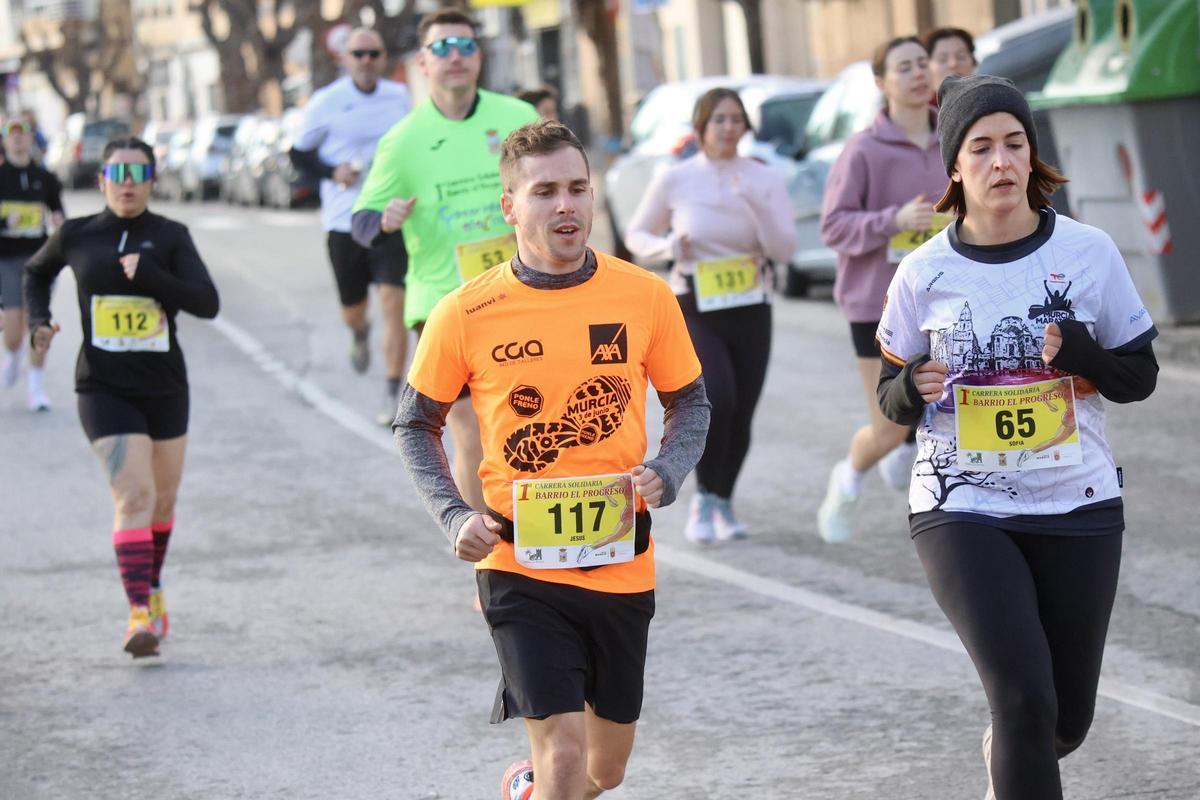 Las imágenes de la carrera popular solidaria en el barrio de El Progreso