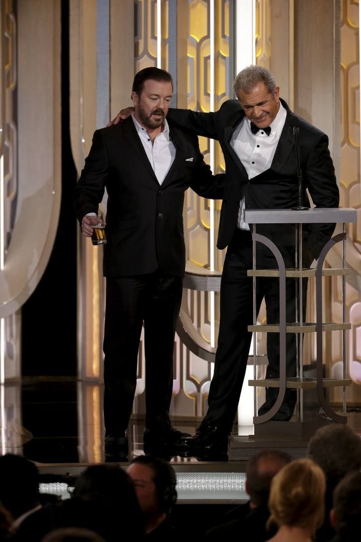 Handout photo of host Ricky Gervais standing with presenter Mel Gibson at the 73rd Golden Globe Awards in Beverly Hills