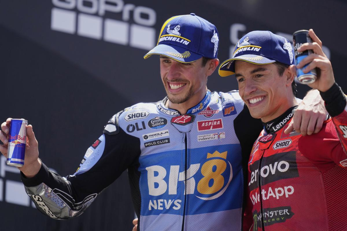 Race winner Spain's rider Marc Marquez of the Ducati Lenovo Team, right, poses with second placed Spain's rider Alex Marquez of the BK8 Gresini Racing MotoGP after the MotoGP race of the Grand Prix of Aragon at the MotorLand Aragon circuit, in Alcaniz, Spain, Sunday, June 8, 2025. (AP Photo/Jose Breton)