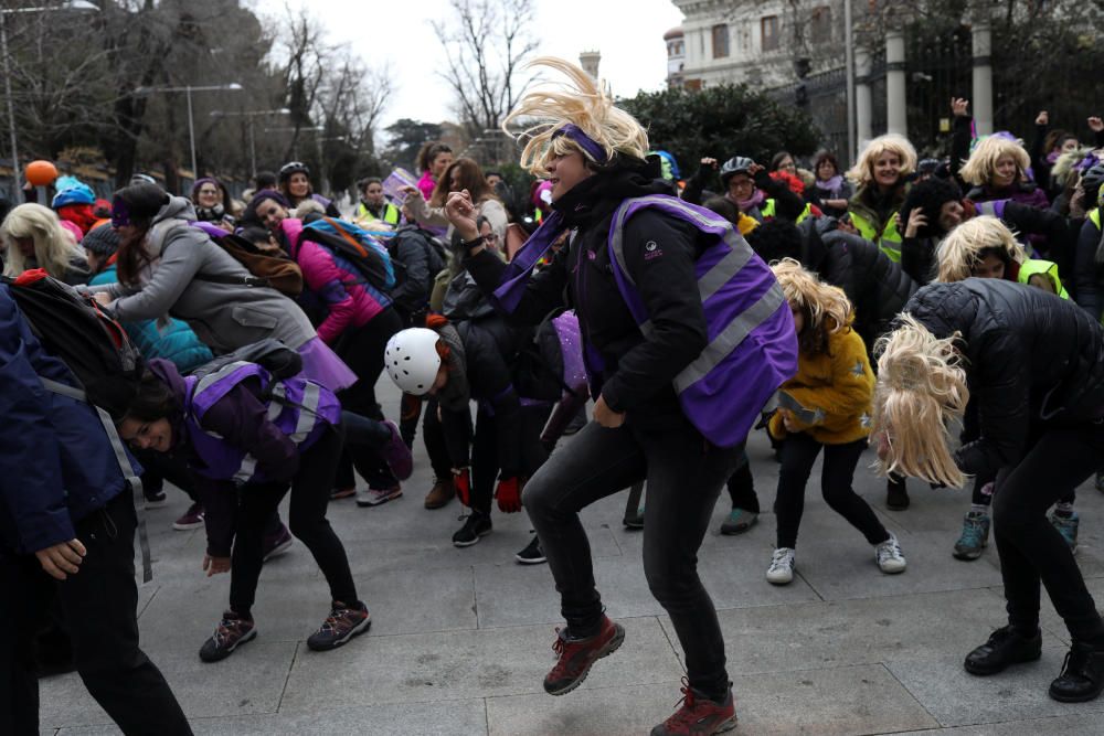 Women dance during a protest as as part of a ...