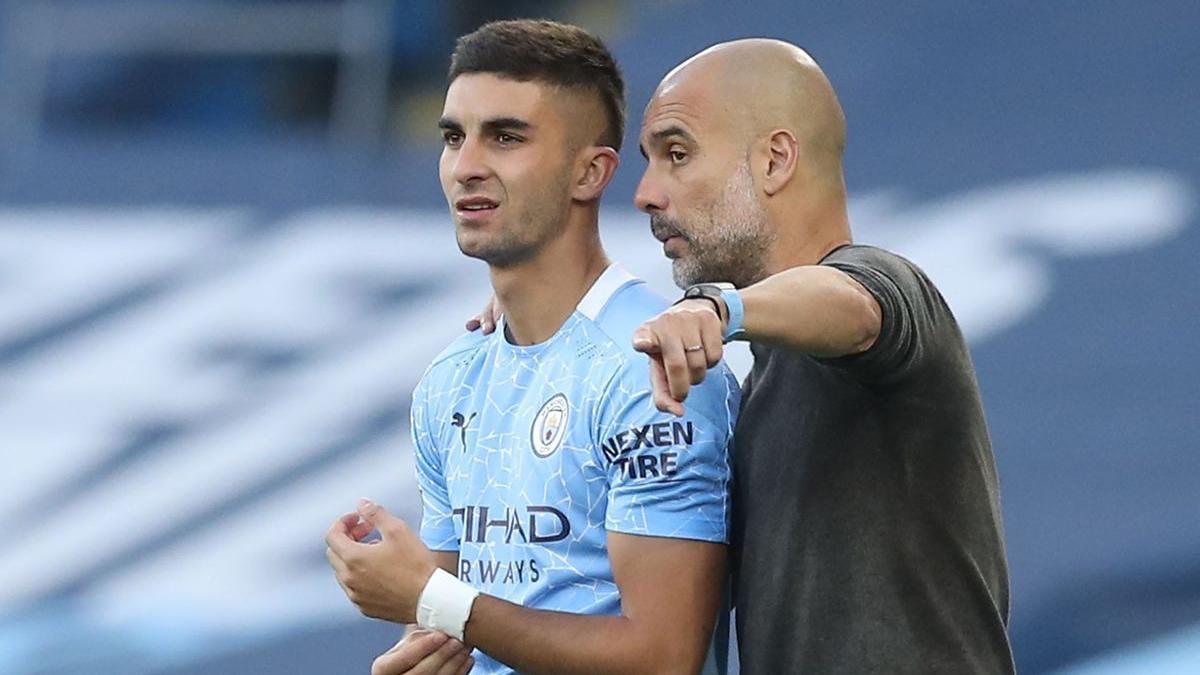 Pep Guardiola y Ferran Torres durante la pasada temporada.