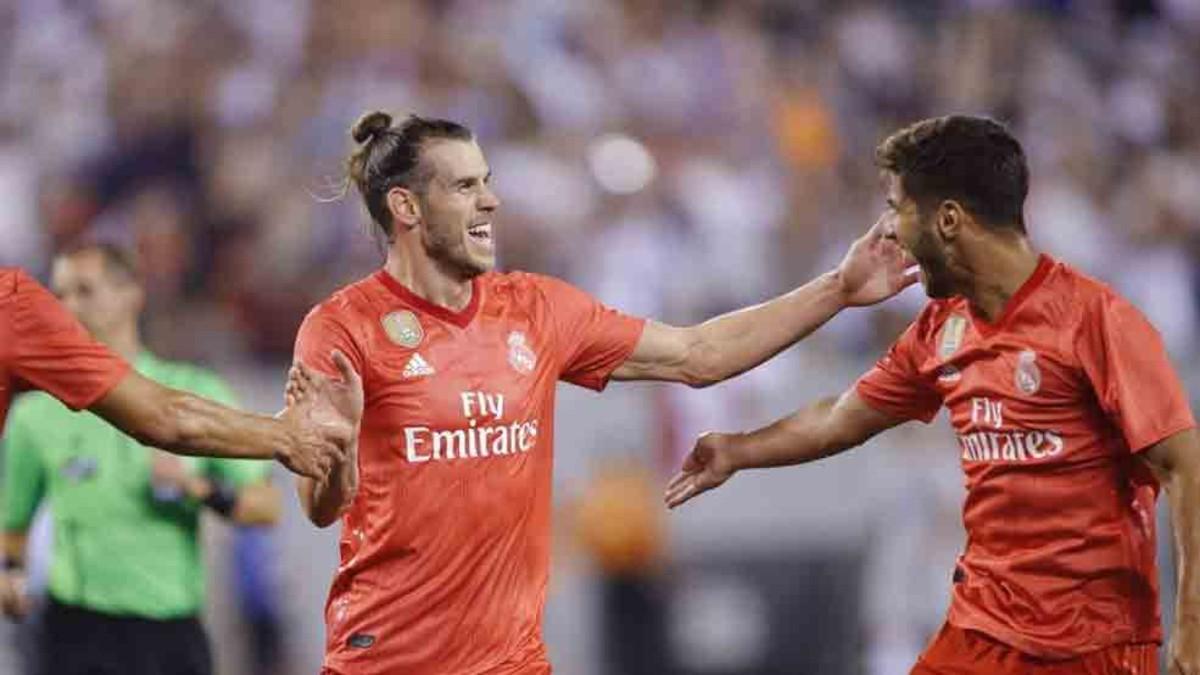 Bale y Asensio celebran uno de los goles