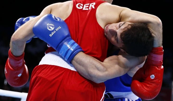 Gashi of Germany fights with Yilmaz of Turkey during their men's 60kg round of 32 boxing fight at the 1st European Games in Baku, Azerbaijan