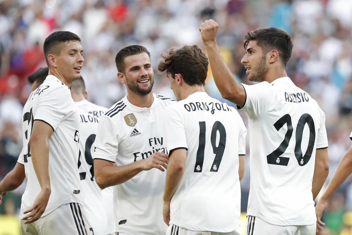 Aug 4  2018  Landover  MD  USA  Real Madrid midfielder Marco Asensio  20  celebrates with teammates after scoring a goal against Juventus in the second half during an International Champions Cup soccer match at FedEx Field  Real Madrid won 3-1  Mandatory Credit  Geoff Burke-USA TODAY Sports