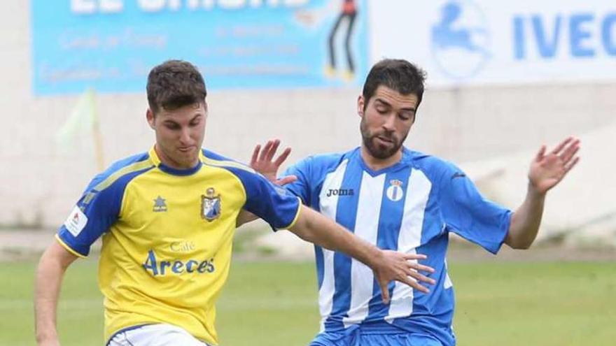 Nacho Méndez, con Aitor Segovia, del Mosconia.