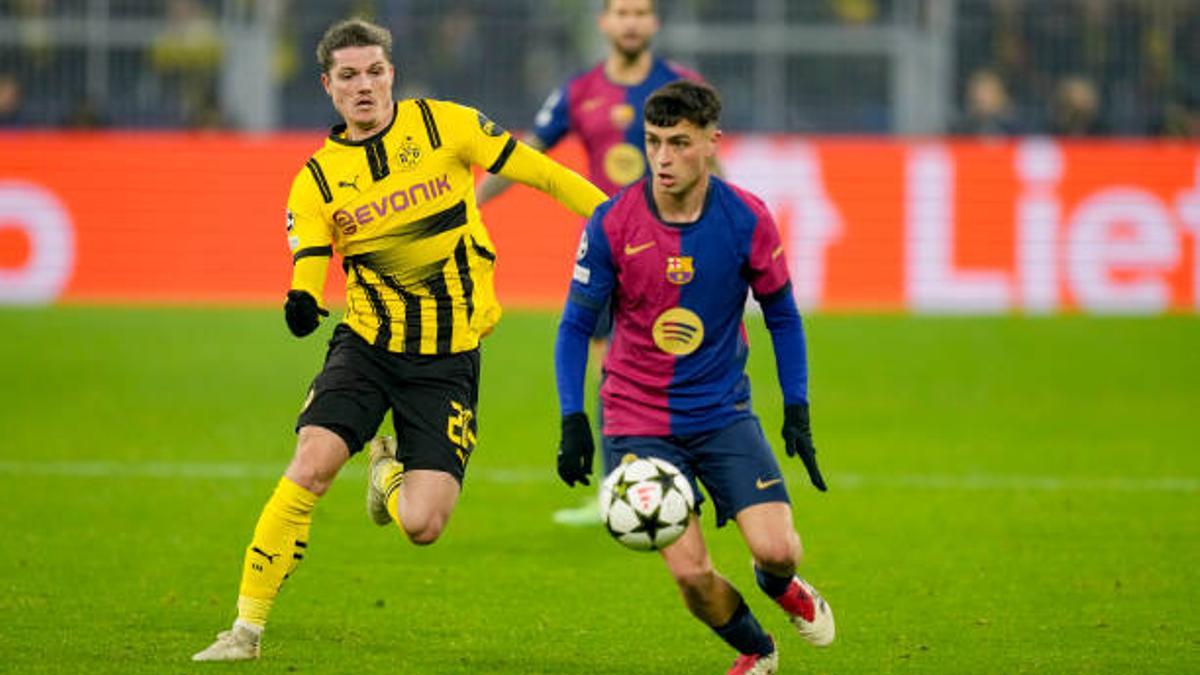 Dortmund, Germany - December 11: Marcel Sabitzer of Borussia Dortmund and Pedri of FC Barcelona battle for the ball during the UEFA Champions League 2024/25 League Phase MD6 match between Borussia Dortmund and FC Barcelona at Signal Iduna Park on December 11, 2024 in Dortmund, Germany. (Photo by Alex Gottschalk/DeFodi Images via Getty Images)