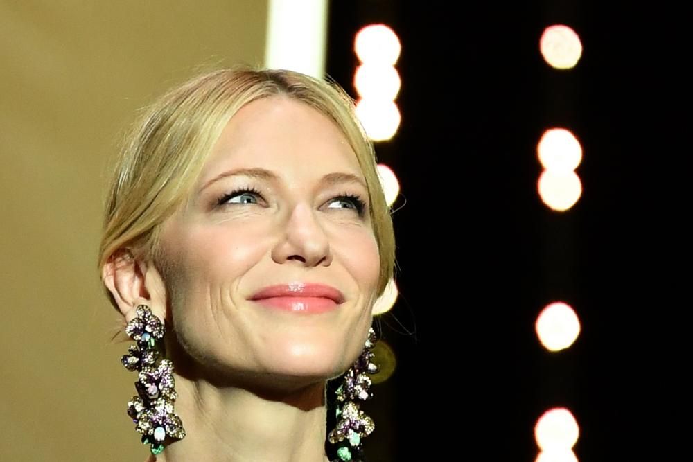 Australian actress and President of the Jury Cate Blanchett smiles as she arrives on stage on May 8, 2018 during the opening ceremony of the 71st edition of the Cannes Film Festival in Cannes, southern France.  / AFP PHOTO / Alberto PIZZOLI