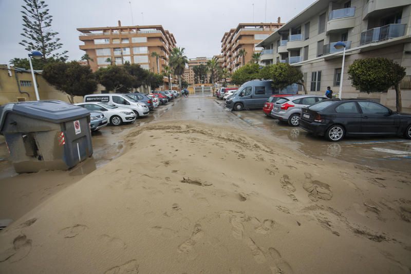 Temporal de lluvia: las mejores imágenes del paseo marítimo de València cubierto de arena