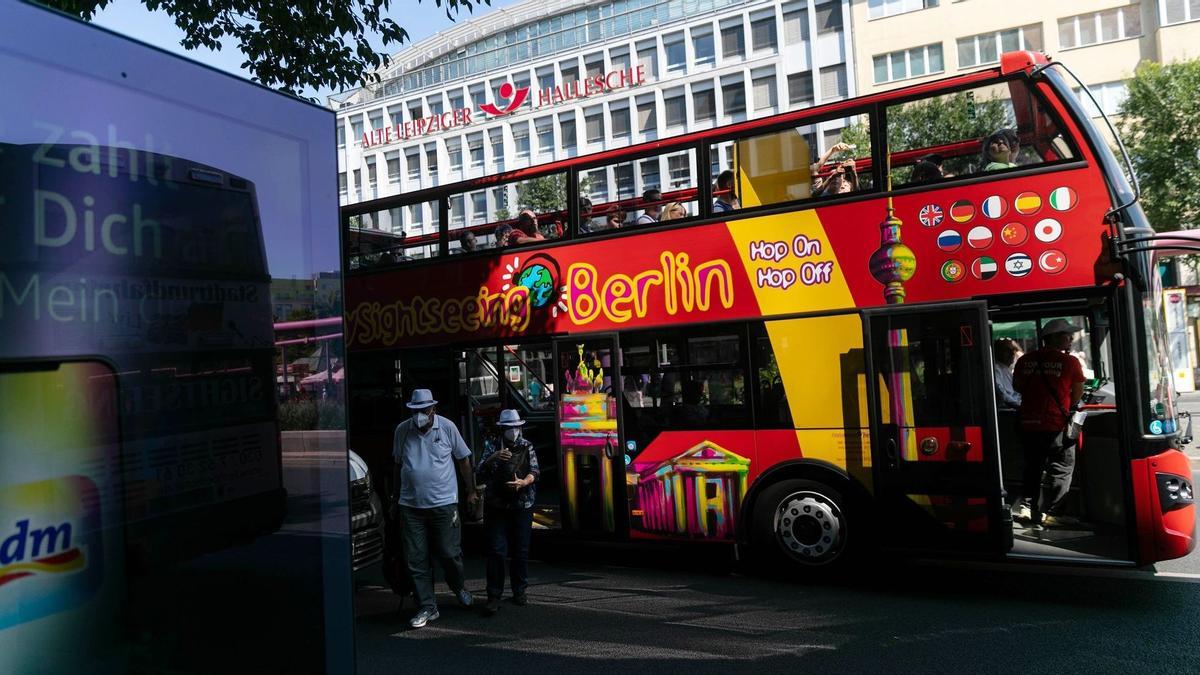 Passengers disembark a tourist bus in Berlin, Germany, on Tuesday, Aug. 9. 2022. German Finance Minister Christian Lindner said he will look at ways of exempting the country's looming gas levy from sales tax in an effort to at least partially ease the burden on consumers from soaring energy costs. Photographer: Krisztian Bocsi/Bloomberg