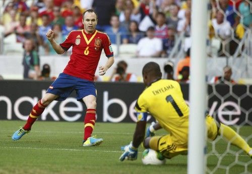 Nigeria's goalkeeper Enyeama makes a save on a shot by Spain's Iniesta during their Confederations Cup Group B soccer match at the Estadio Castelao in Fortaleza