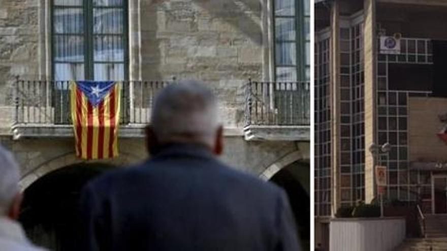 A l&#039;esquerra, l&#039;estelada, penjada a l&#039;Ajuntament de Manresa. A la dreta, la bandera negra de Puig-reig.