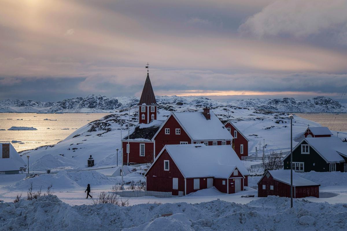 FILE - A woman walks near a church in Nuuk, Greenland, on March 7, 2025. (AP Photo/Evgeniy Maloletka, File) Associate Press/ LaPresse Only Italy and Spain. EDITORIAL USE ONLY ITALY AND SPAIN
