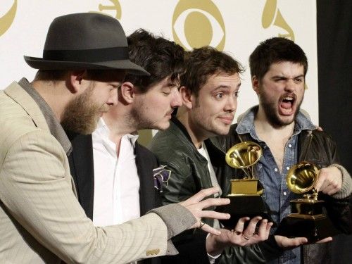 Mumford & Sons pose with their awards for Album of the Year and Best Long Form Music Video at the 55th annual Grammy Awards in Los Angeles
