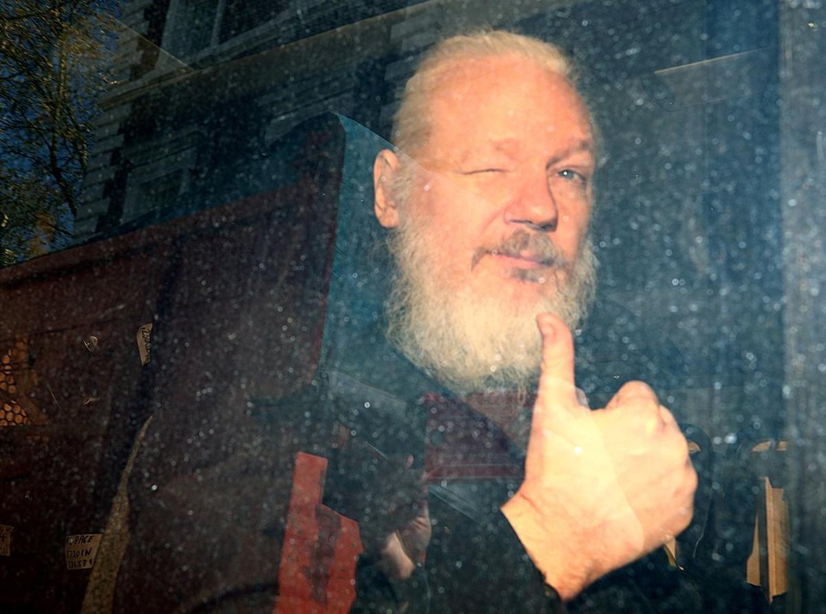 FILE PHOTO: WikiLeaks founder Julian Assange arrives at the Westminster Magistrates Court, after he was arrested  in London, Britain, April 11, 2019. Reuters Photographer Hannah McKay:/File Photo