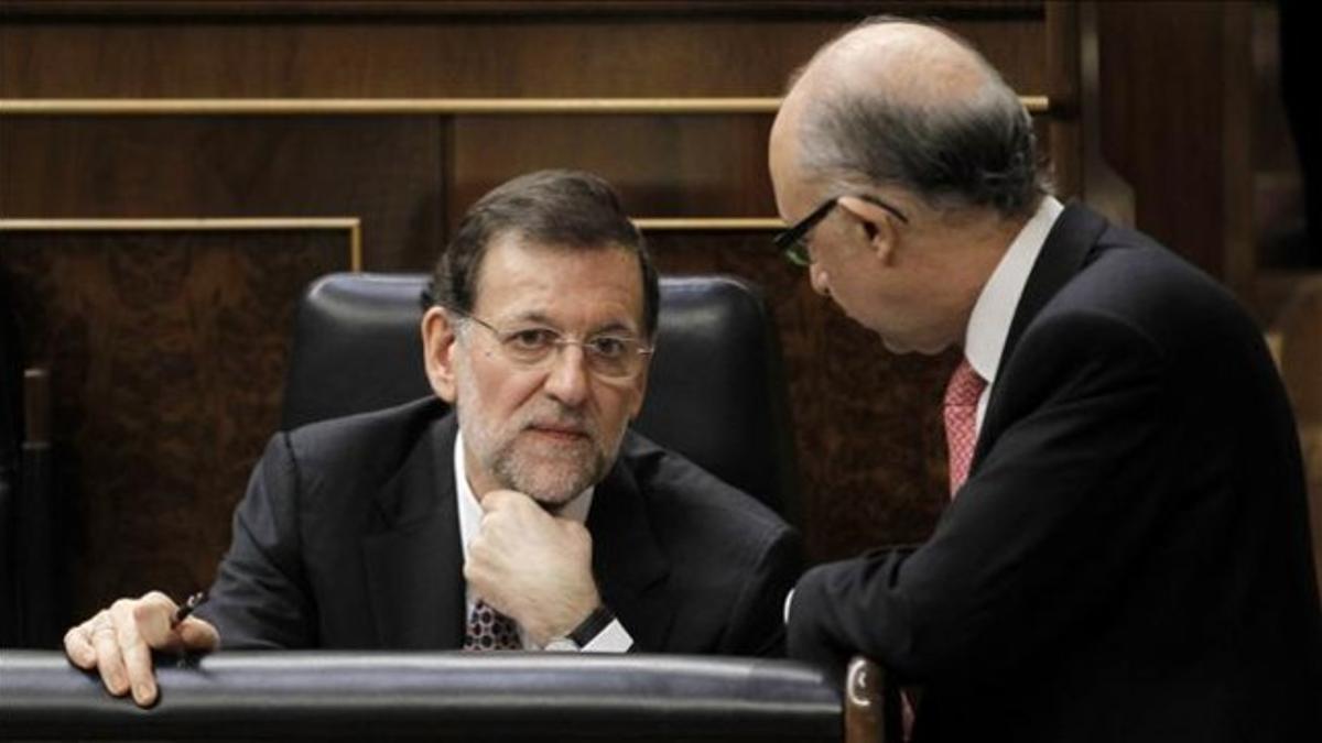 Mariano Rajoy y Cristóbal Montoro, en el Congreso.