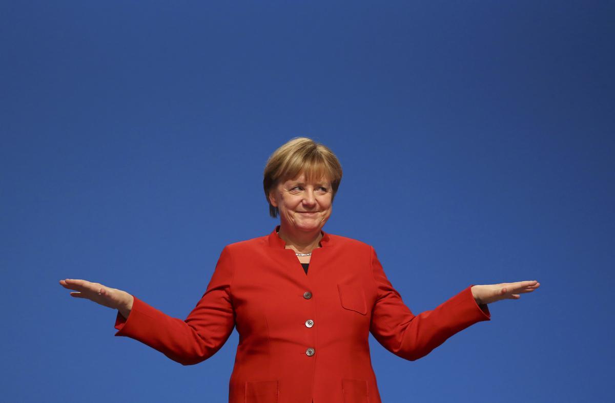 German Chancellor and leader of the conservative CDU Merkel reacts after her speech at the CDU party convention in Essen