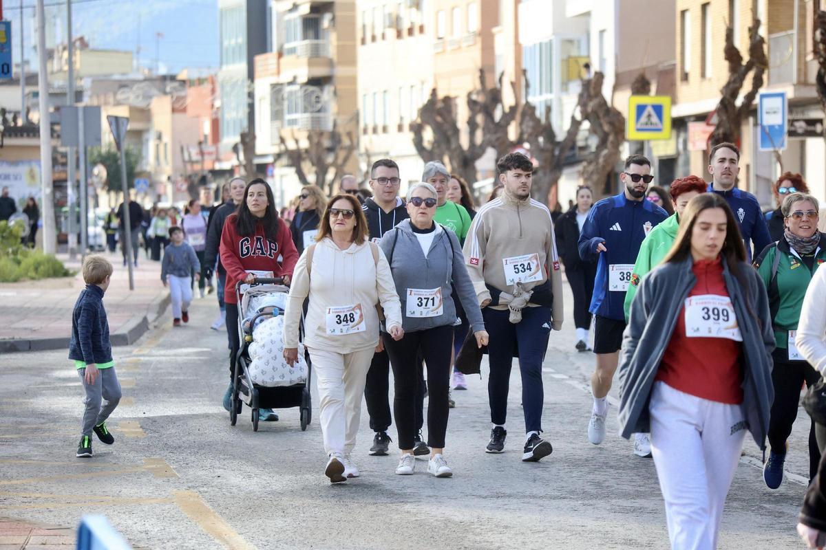 Las imágenes de la carrera popular solidaria en el barrio de El Progreso