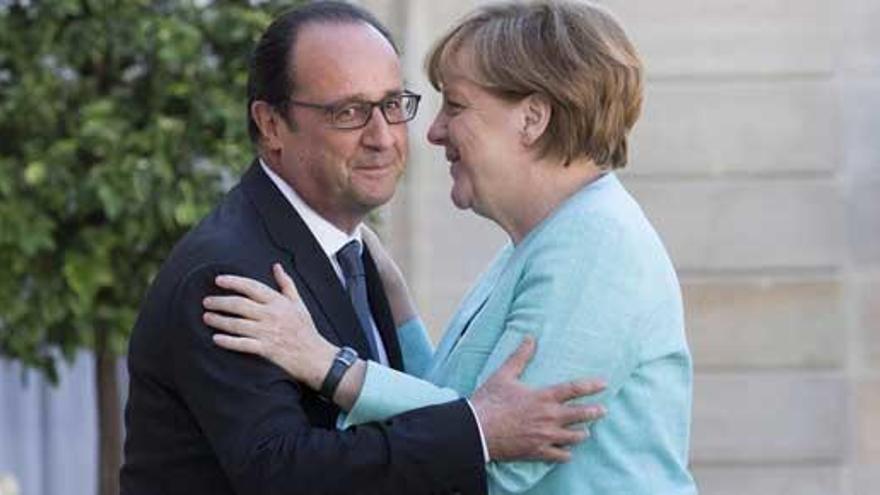 Hollande y Merkel, en el Elíseo.