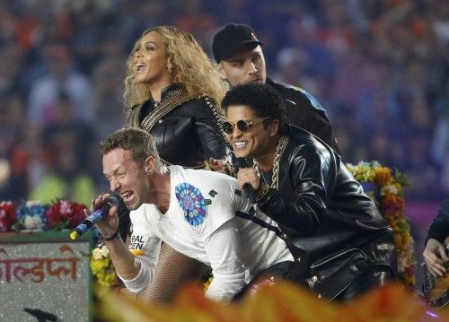 Beyonce, Martin and Mars perform with guitarist Buckland at the half-time show during the NFL's Super Bowl 50 football game between the Carolina Panthers and the Denver Broncos in Santa Clara