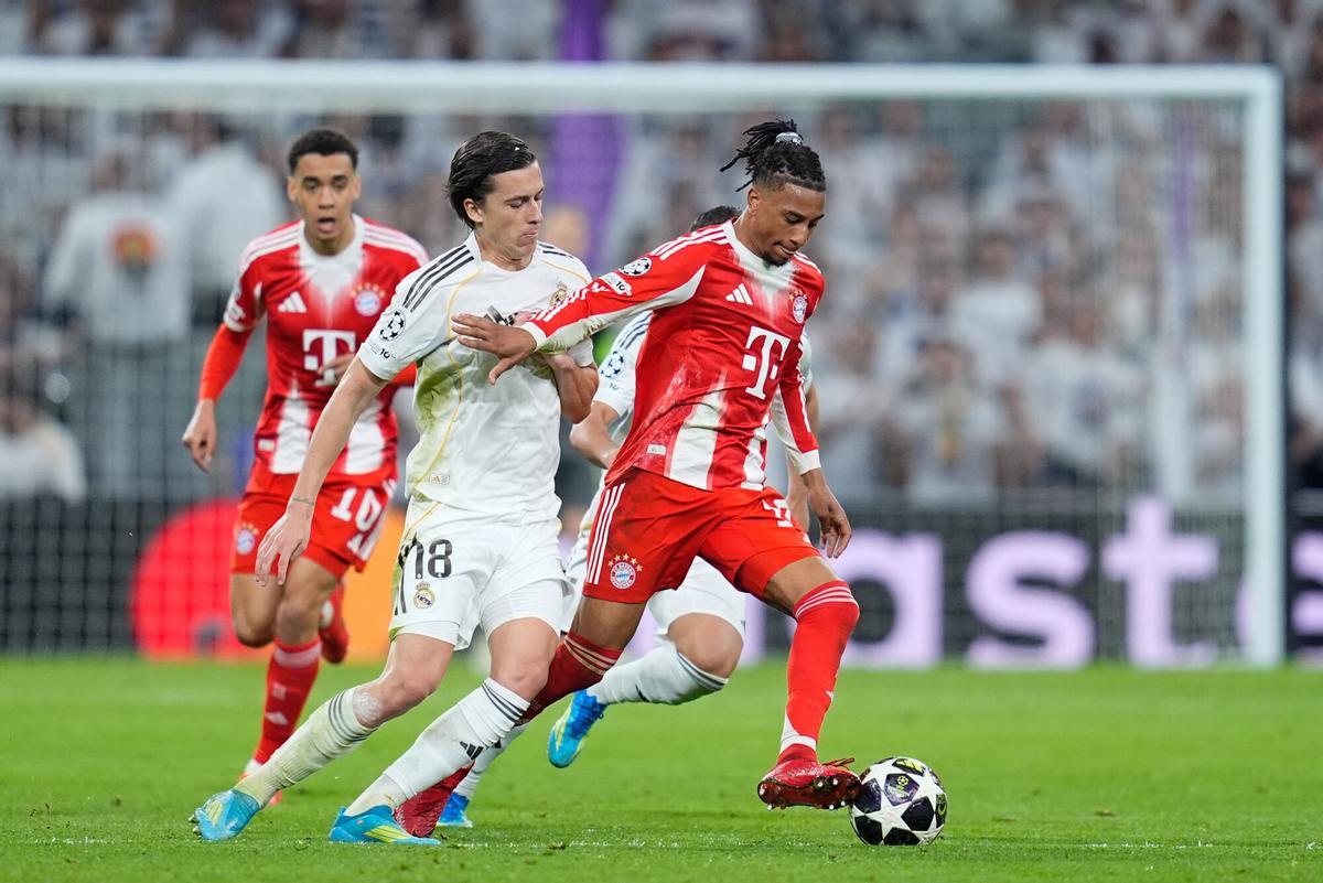 Michael Olise of Bayern Munich and Alvaro Carreras of Real Madrid CF compete for the ball during the UEFA Champions League 2025/26 Quarter-finals First Leg match between Real Madrid C.F. and Bayern Munich at Bernabeu stadium on April 07, 2026, in Madrid, Spain. AFP7 07/04/2026 ONLY FOR USE IN SPAIN. Dennis Agyeman / AFP7 / Europa Press;2026;SOCCER;SPAIN;SPORT;ZSOCCER;ZSPORT;Real Madrid C.F. v Bayern Munich - UEFA Champions League 2025/26 Quarter-finals First Leg;