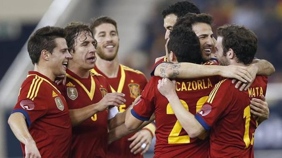 jtiospain s players celebrate a goal against uruguay d130206210238