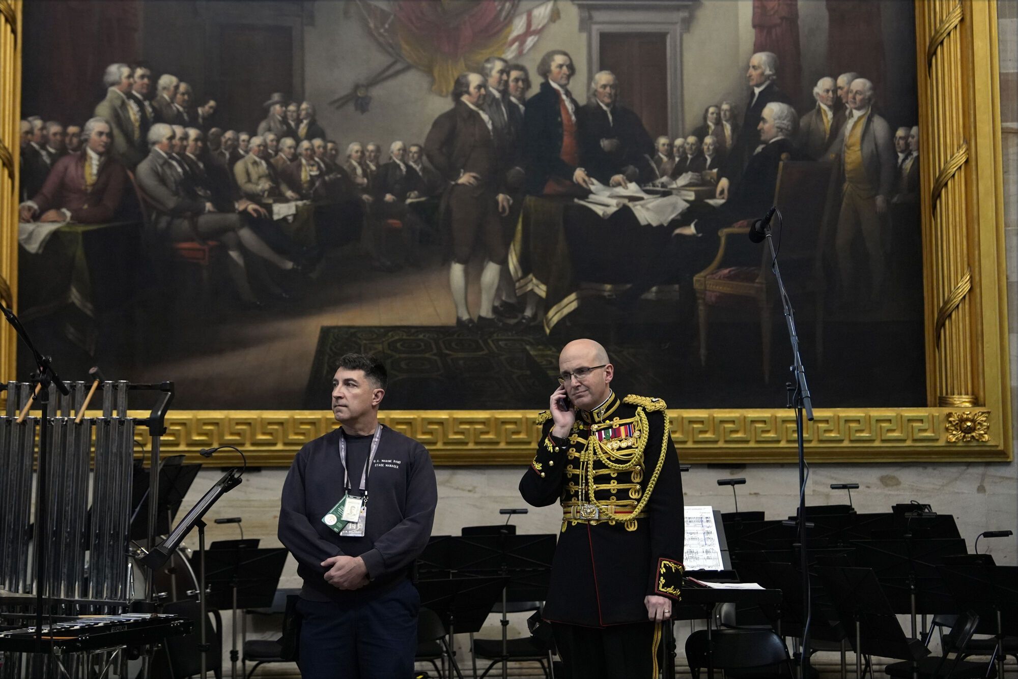 Director of "The President's Own" U.S. Marine Band, Lt. Col. Ryan Nowlin talks on the phone before the 60th Presidential Inauguration in the Rotunda of the U.S. Capitol in Washington, Monday, Jan. 20, 2025. (AP Photo/Julia Demaree Nikhinson, Pool). Pool Photo