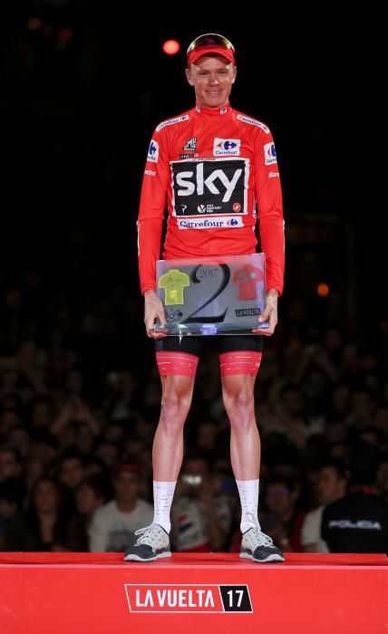 Team Sky rider Chris Froome of Britain holds a ...